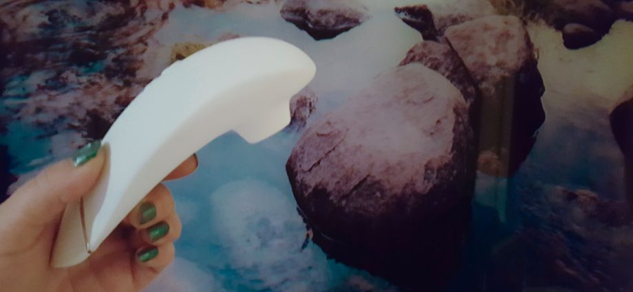 Photo of the small oval Blush Novelties Exposed Nocturnal Vibrator Buttons on the base of the toy.