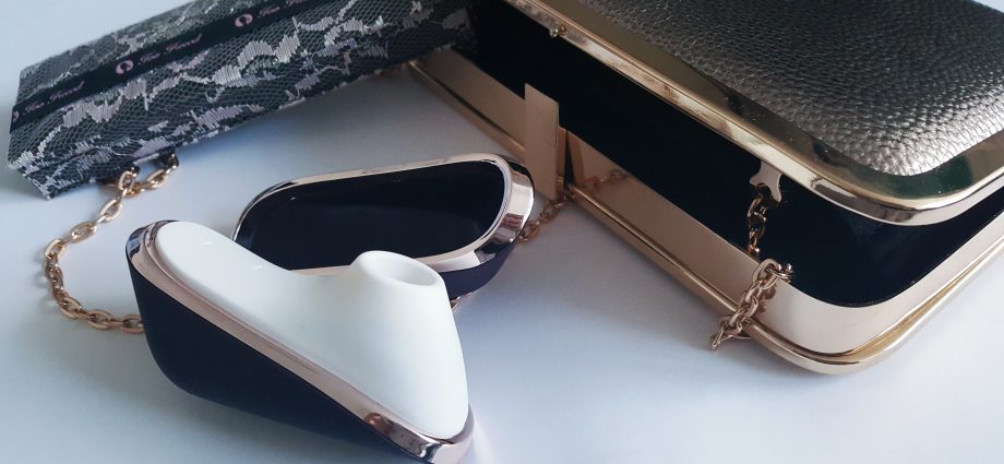 Image of the Doc Johnson Kink Pulse Ultimate 4 Motor Vibrator Packaging. A rectangular black cardboard box with life-size image of vibrator on front.